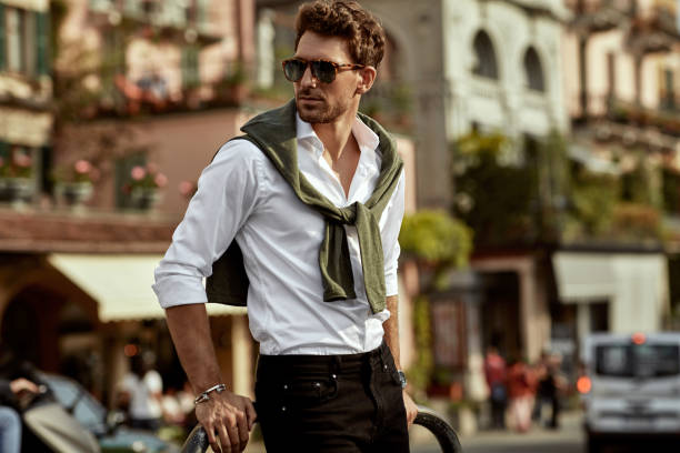 A person with hair wearing a timeless, tailored Italian outfit, showing off a blend of elegance and confidence